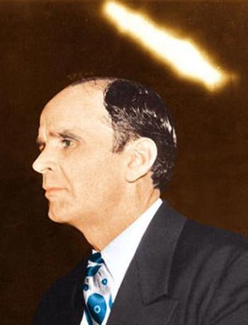 William Branham photographed preaching with a divine halo over his head